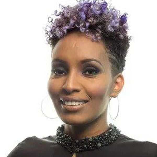 Portrait of Eden Tekle, a professional stylist at Eden DC Salon, showcasing their expertise and style.