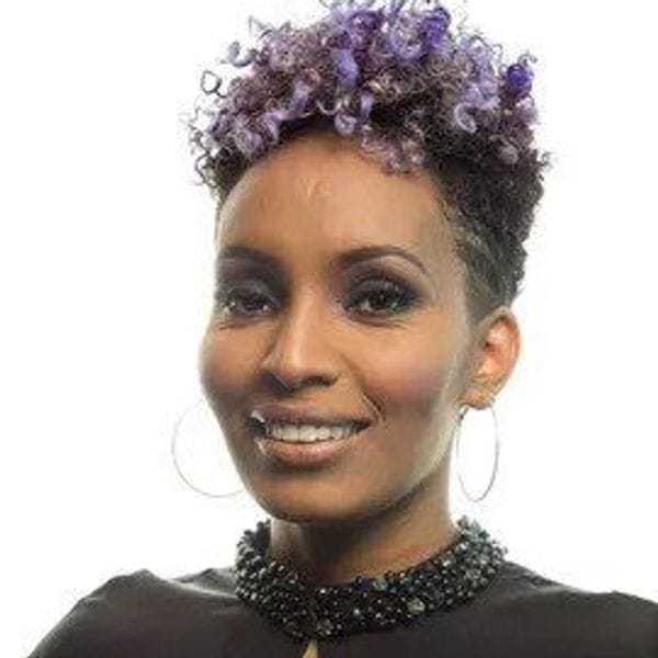 Portrait of Eden Tekle, a professional stylist at Eden DC Salon, showcasing their expertise and style.