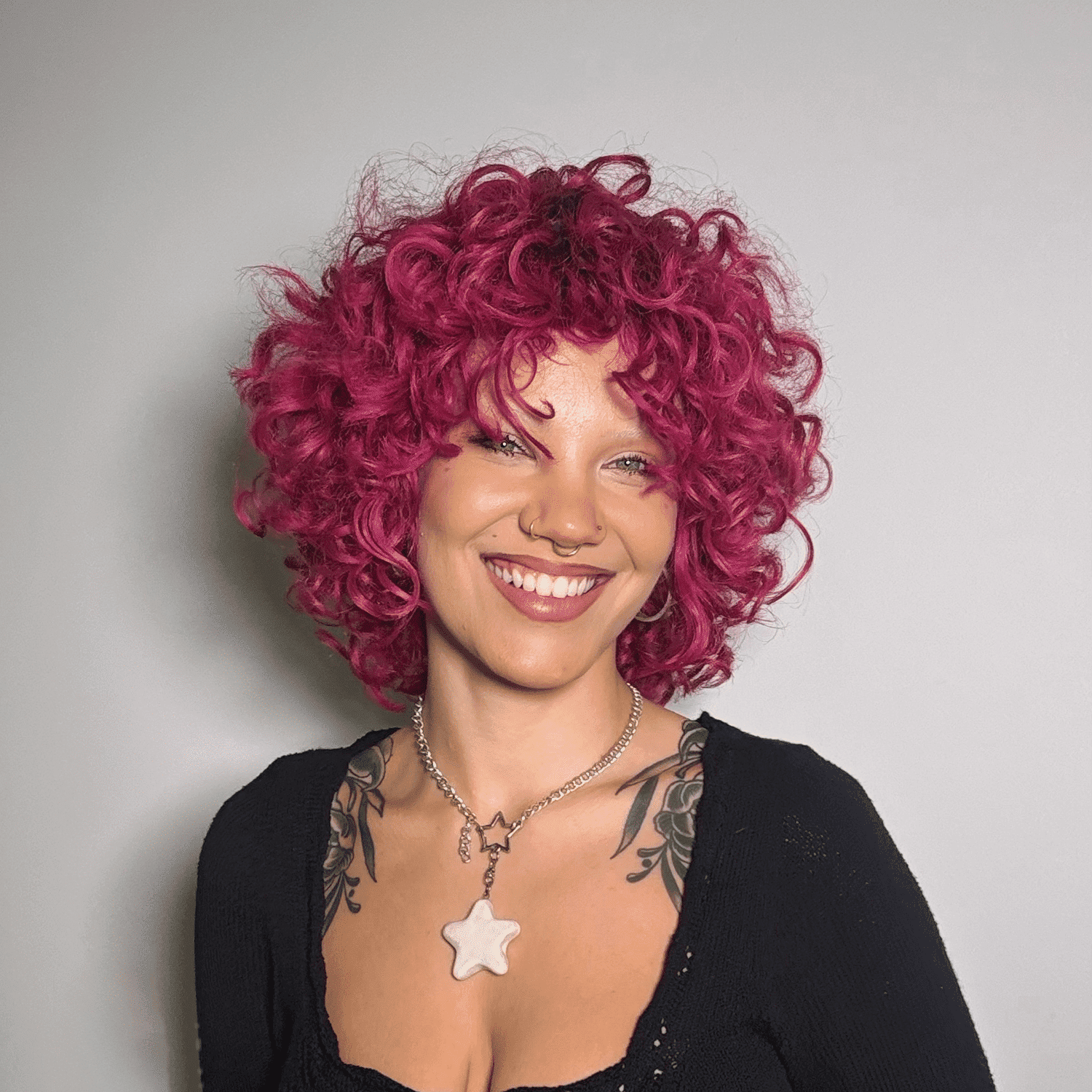 Portrait of Sophia, a professional stylist at Eden DC Salon, showcasing their expertise and style.