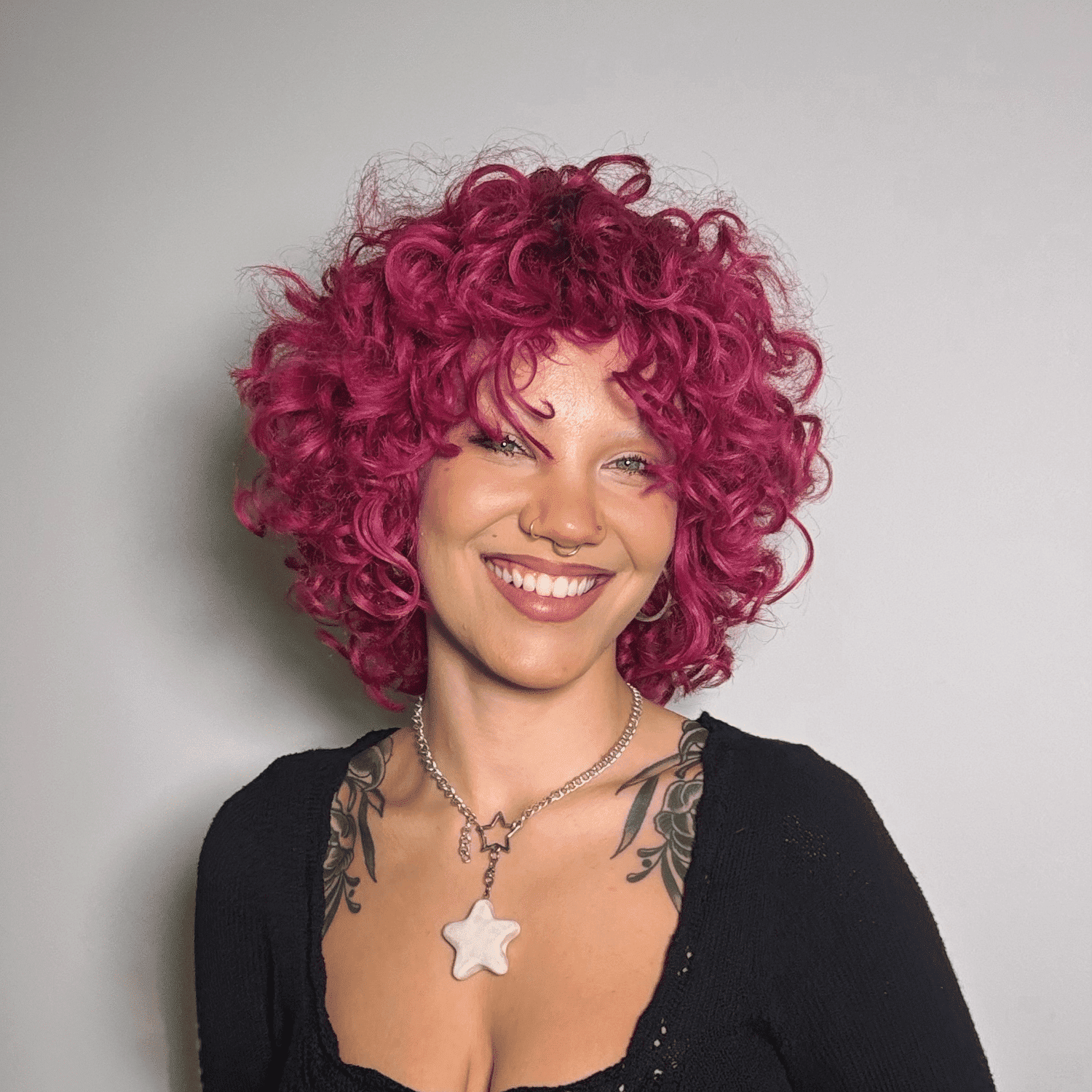 Portrait of Sophia, a professional stylist at Eden DC Salon, showcasing their expertise and style.