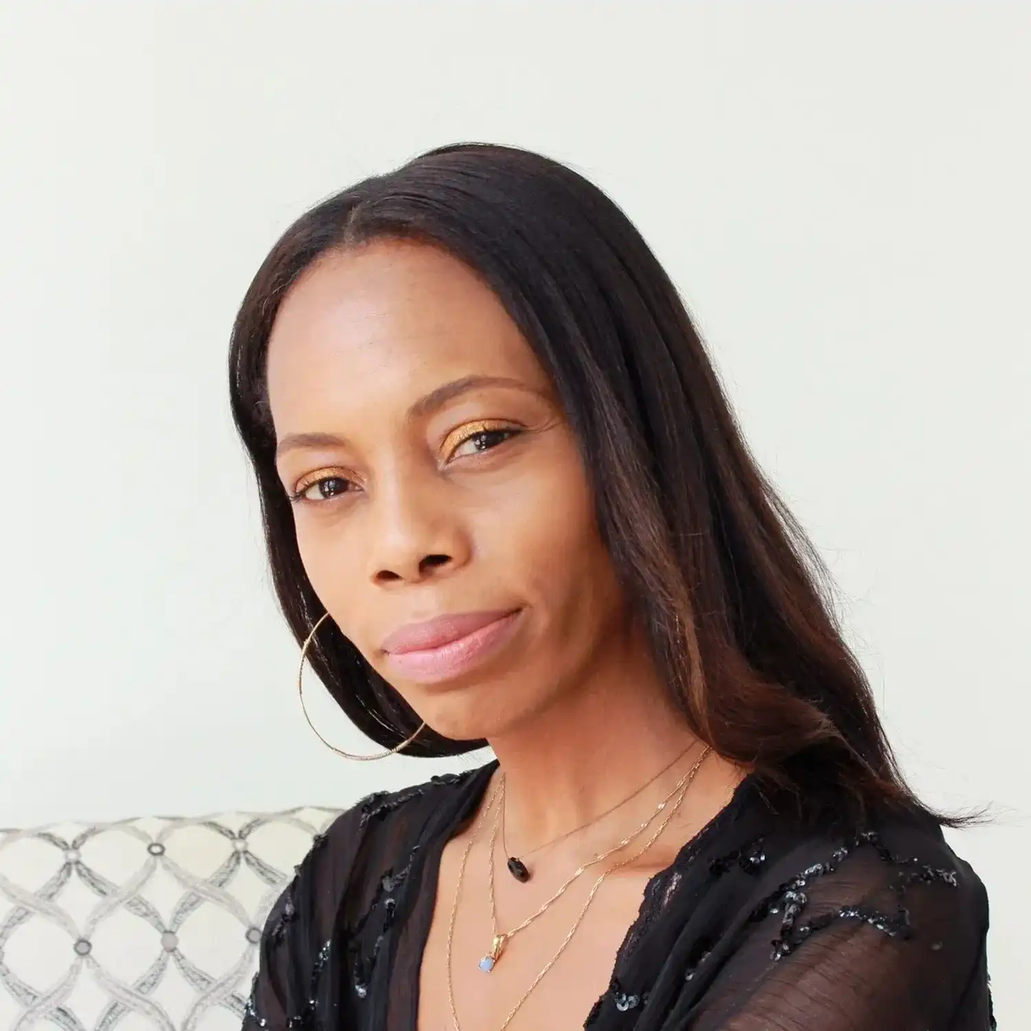 Portrait of Jasmine, a professional stylist at Eden DC Salon, showcasing their expertise and style.